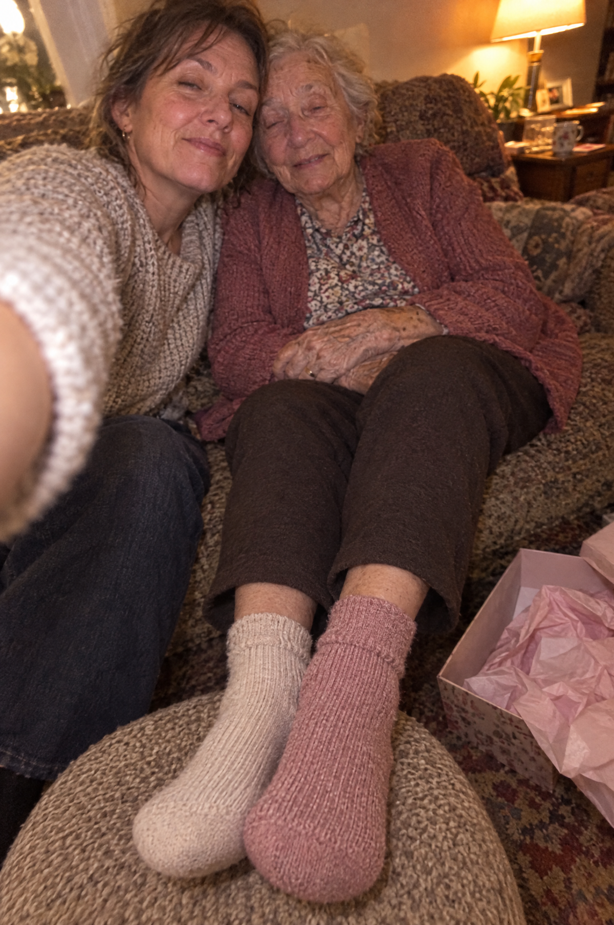 Mother and daughter selfie on the sofa in HugStep socks